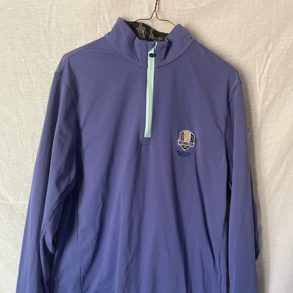 Three quarter zip long sleeve golf shirt w/ 2020 Ryder Cup logo.